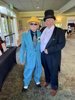 Woodinville Rotarians Erv DeSmet (left) and Tom Robinson (right)
joined other Rotarians at their annual auction Saturday, April 29.
The theme was Roaring 20"s theme, so Rotarians came decked
out to raise funds for our charitable giving.