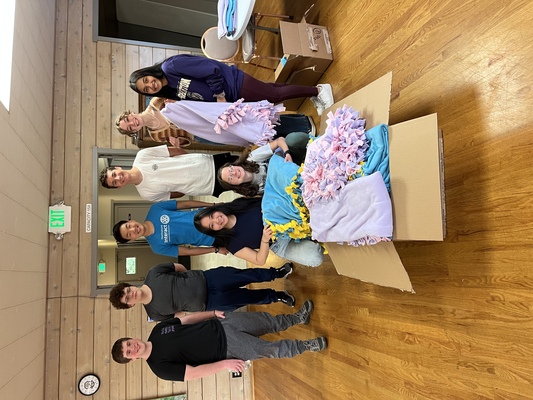 Northshore Interact Blanket Making Service Project: students from
Woodinville High School and North Creek High School gathered
at the Sammamish Valley Grange in late April to make no-sew
blankets to donate to local charity, Bridge Receiving Center. Photo by Carol Lee.