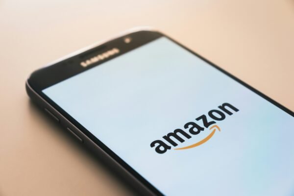 Amazon’s Seattle Hub Launches AI-Powered Delivery System a close up of a cell phone with the Amazon app